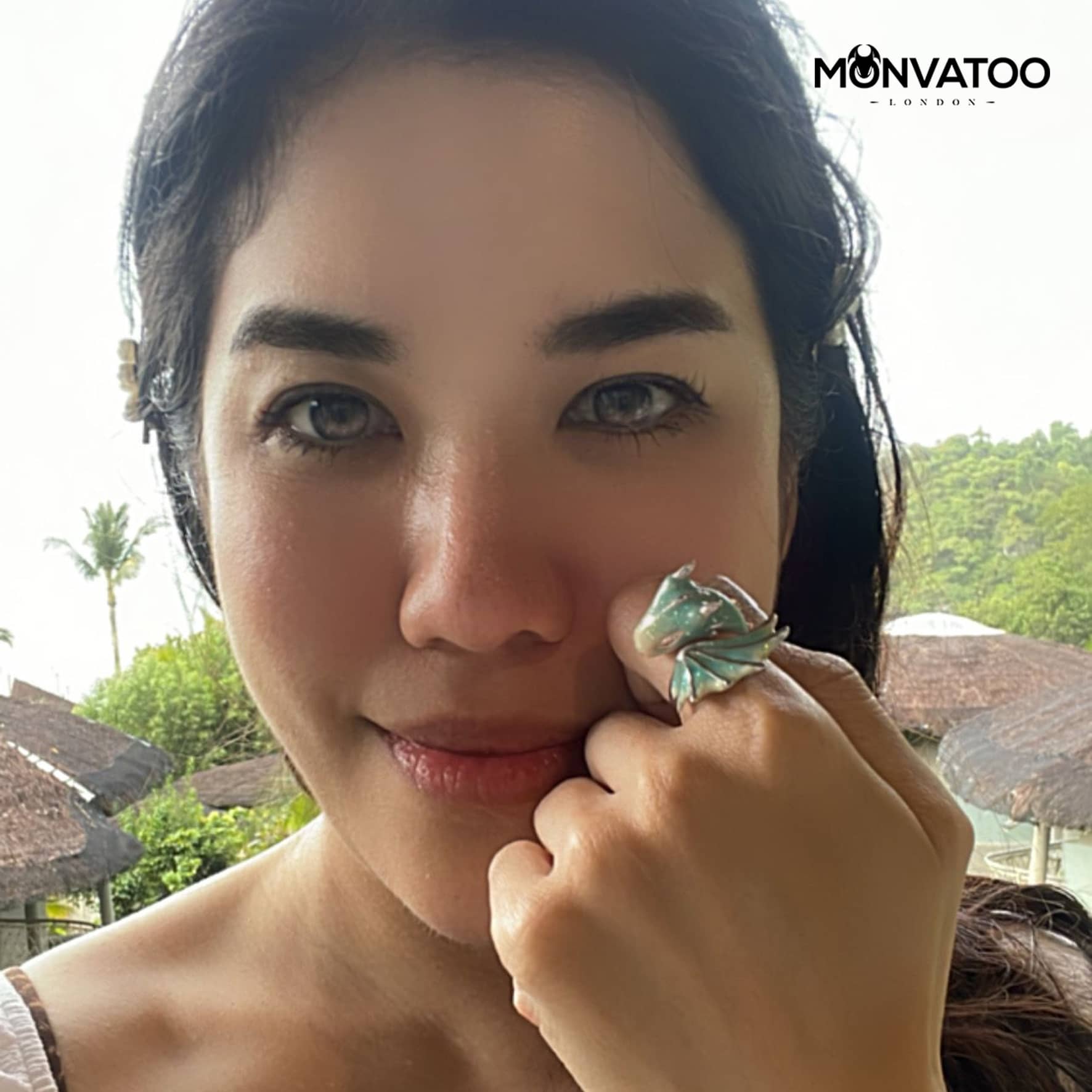 A girl is wearing the silver turquoise dragon ring by MONVATOO London perfect for fantasy lover